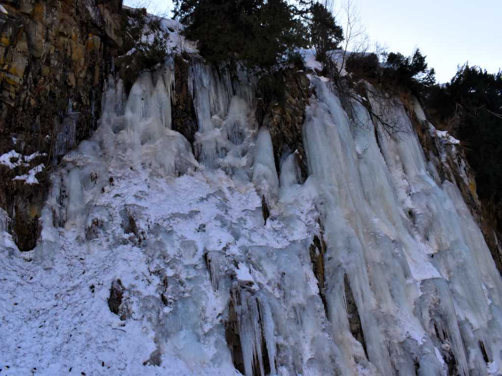 Frozen waterfall Snow slopes and mountains of Gulmarg view sonamarg view during winter Kashmir trip by Eka Experiences