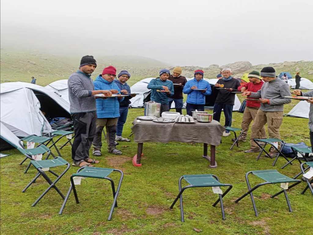 Guests having food at EKA camping site_Successful Trek_Kashmir Great Lakes TRek_Eka Experiences