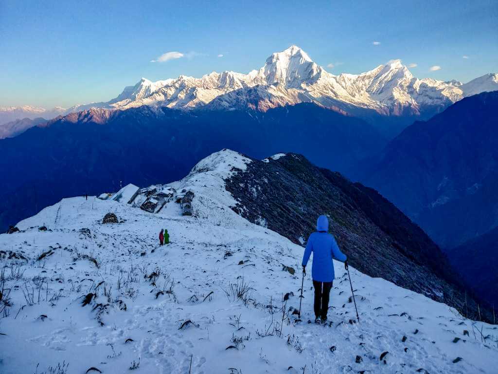 A trekker on Khopra Danda with sunrise views