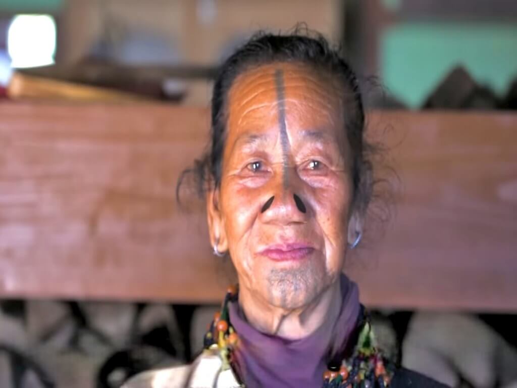 Apatani Woman with traditional Nose Plugs and facial tatto in Ziro Valley Arunachal_Eka Experiences™